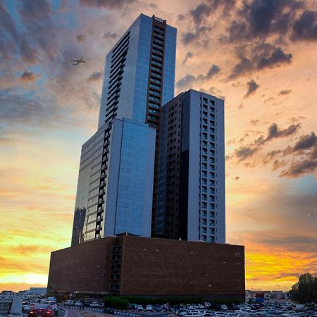 Luxe Grand Hotel Apartments Sharjah Eksteriør billede The building at sunset