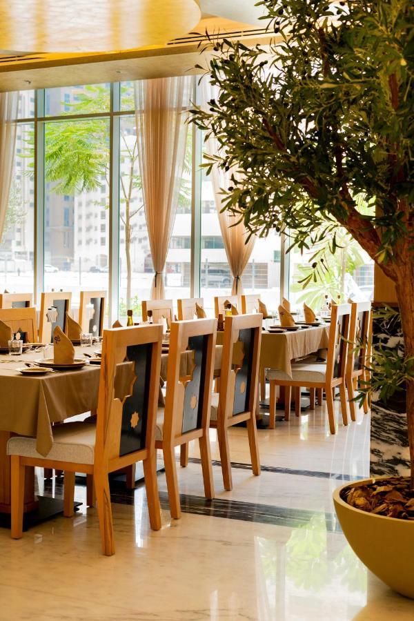 Luxe Grand Hotel Apartments Sharjah Eksteriør billede Restaurant