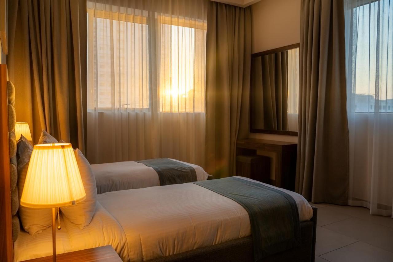 Luxe Grand Hotel Apartments Sharjah Eksteriør billede A bedroom at the hotel