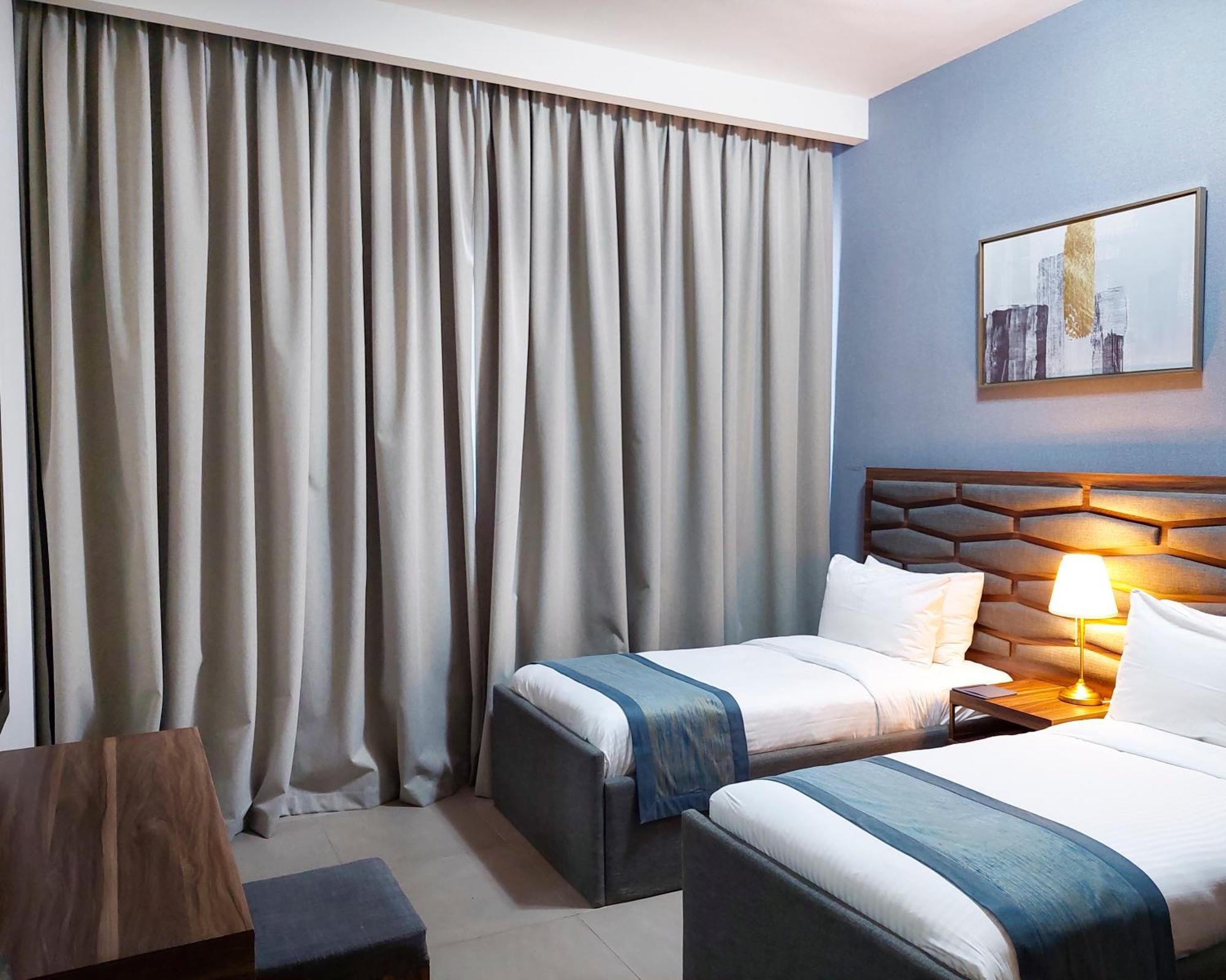 Luxe Grand Hotel Apartments Sharjah Eksteriør billede A bedroom at the hotel
